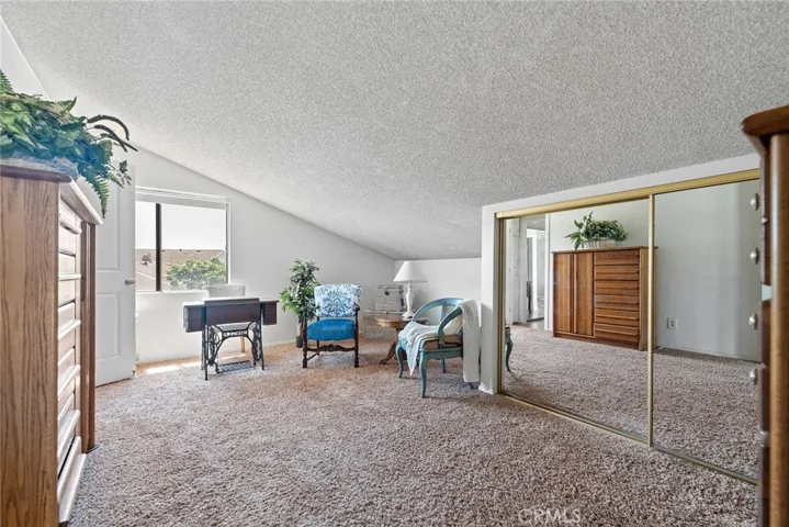 Fourth bedroom upstairs staged as a hobby room