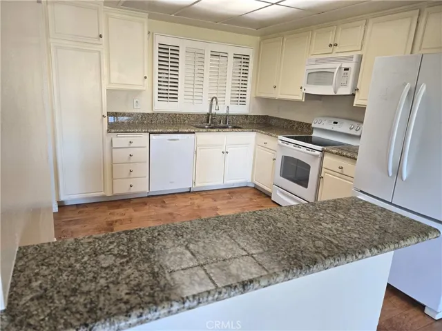 Kitchen view from the dining area, due to a skylight no electric lights were turned on.