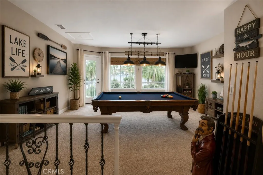 Game room AI generated furniture, wet bar, balcony with lots of room to entertain.