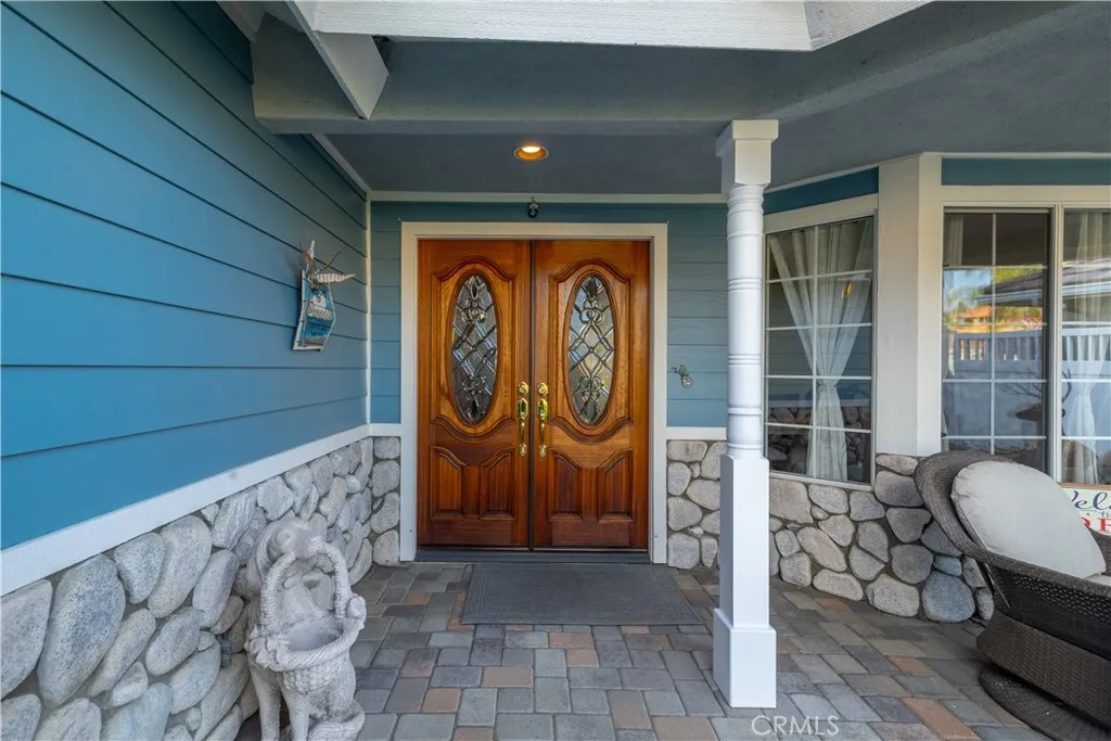 Exquisite front porch double door entry.