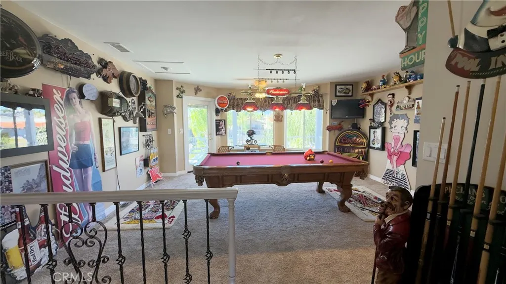 Walk upstairs to your game room with a wet bar, and balcony for entertaining.