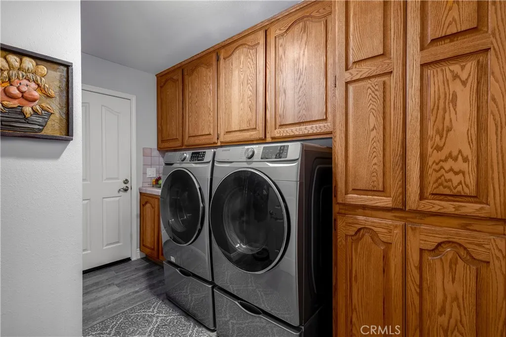Downstairs laundry with a laundry chute, leads out to your deep garage with garage screen door.