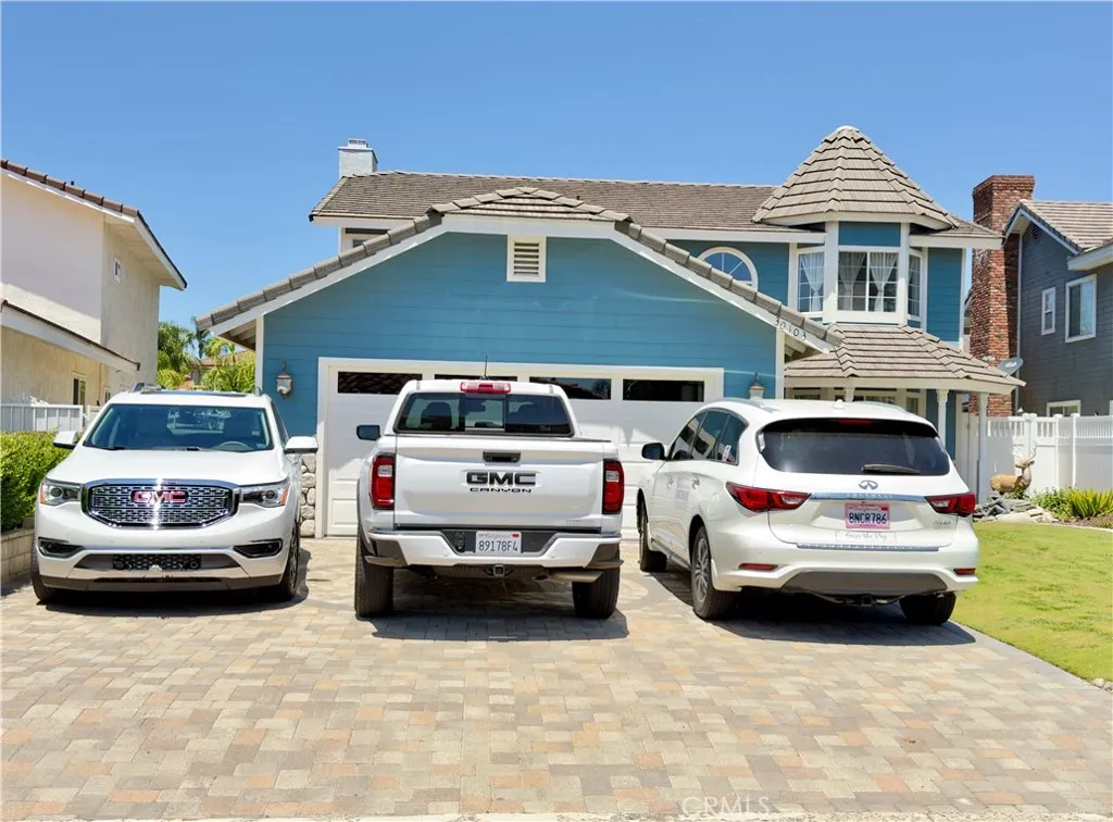 Laundry leads to the garage. Enter the home from your driveway or garage. Three car driveway.