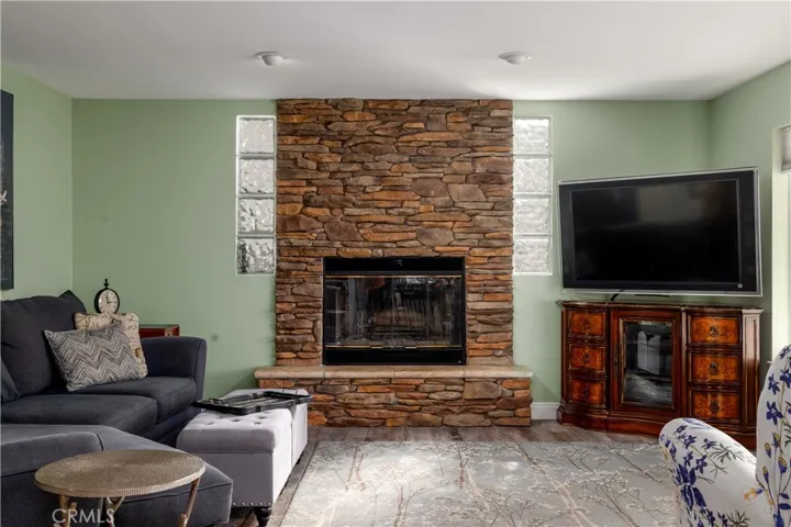 Inviting, and open family room with an updated fireplace and gorgeous views.