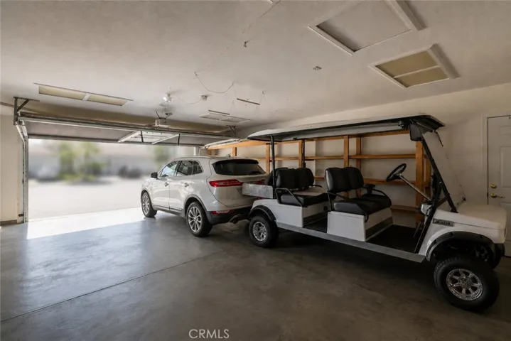 Deep two car garage, this photo was AI generated. Driveway is flat for RV and Boat storage. Inside garage aprx 20x30 - Please verify measurements.