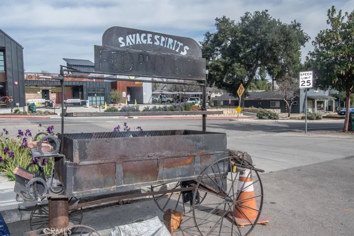 Barbecue area in front of liguor and deli