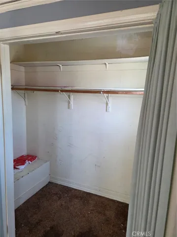 Walk-in closet above stairway