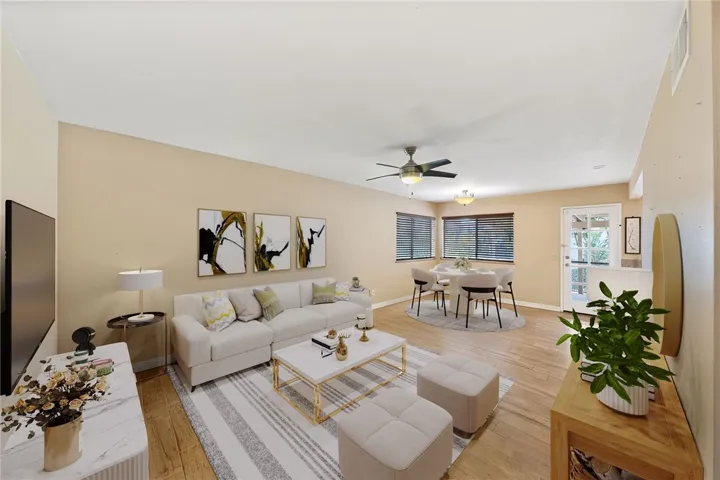Artificial rendering: Versatile family room with ceiling fan, abundant wall space, and a comfortable layout for everyday living.