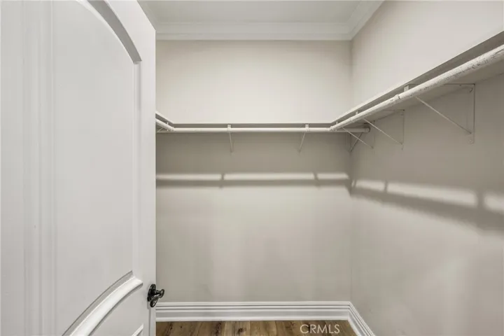 Primary bedroom walk-in closet