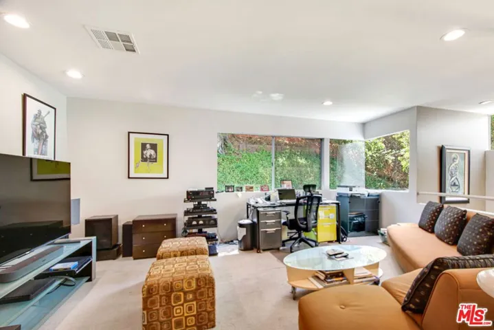Den overlooks the living room