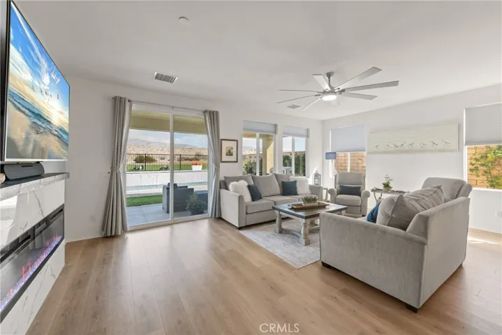 Fireplace and tall doors open to the outdoor room