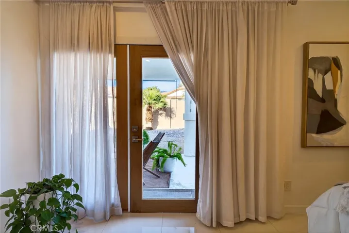 Primary Leading to Back Yard and Covered Patio