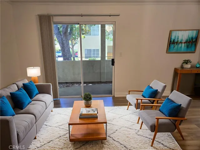 Living room (showing the patio door) virtually staged