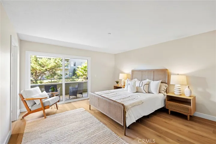 Secondary bedroom with private balcony and walk-in closet