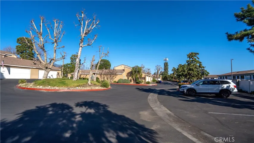 Guest parking spaces along the right side of the street.
