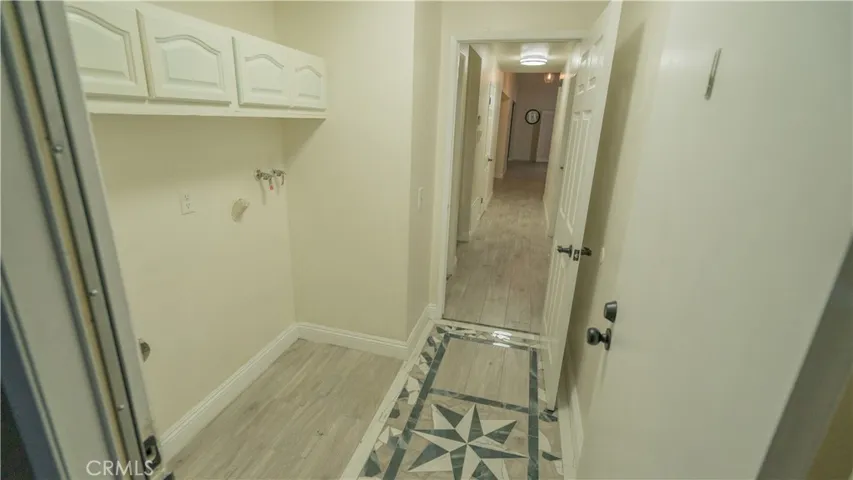 Laundry area entry from garage.