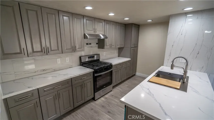 Fully renovated single-story condo featuring a designer kitchen, spacious layout, and attached two-car garage in the desirable Mountain Gate Community.