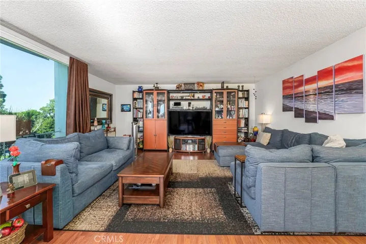 Living Room with Floor to Ceiling Sliders and Windows