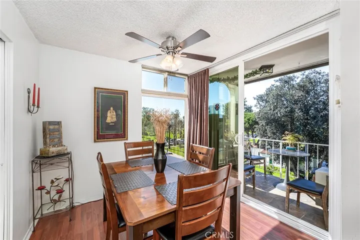 Dining Room with Floor to Ceiling Slider and Window