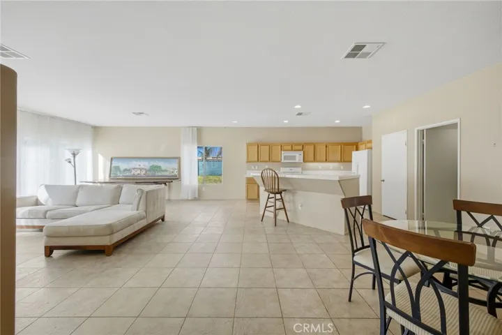 Kitchen overlooks family room.