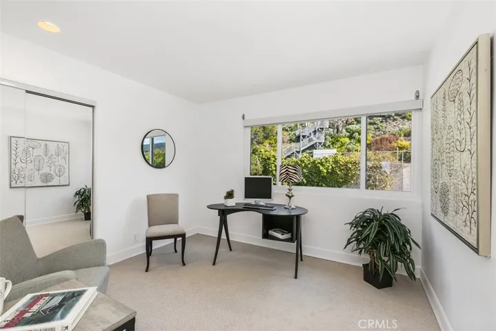 The third bedroom is set up as an office but also has views + mirrored closets (prior staging)