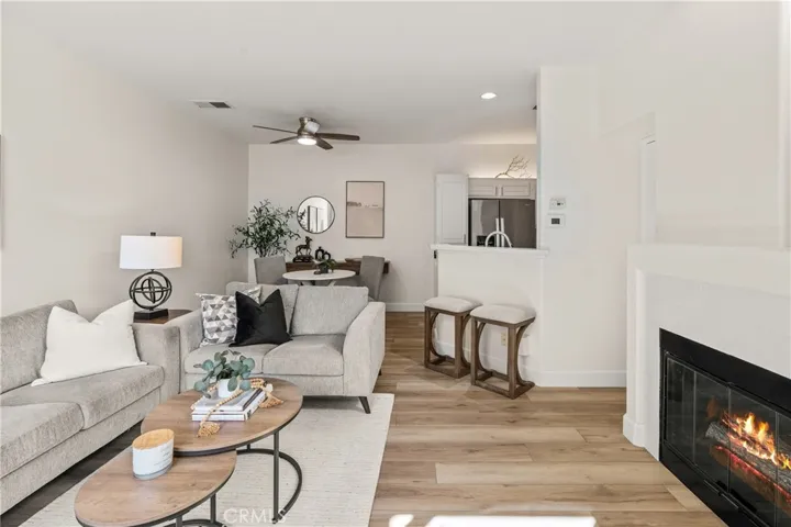 Spacious living room with fireplace and patio