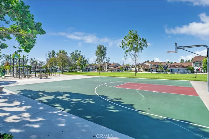 Basketball and Playground right across street from community