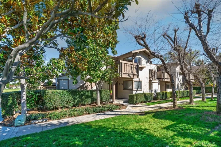 Upper level condo on corner lot on small greenbelt