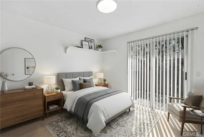 Front Bedroom virtually staged, with slider to a second deck