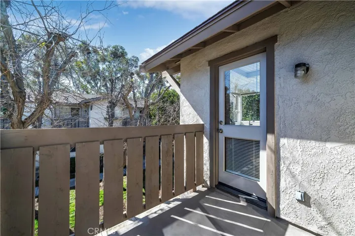 Second Deck with door to Kitchen and sliders to Front Bedroom