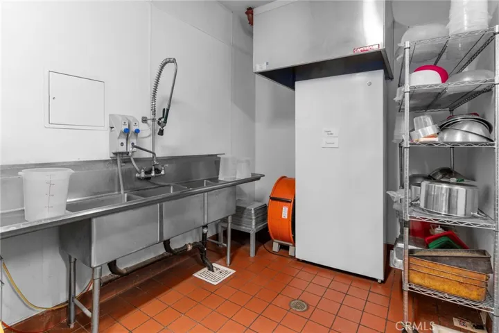 Dishwashing station. Hood installed for potential dishwashing machine.