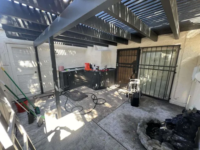 Large private patio with direct access to the unit’s two carport parking spots.