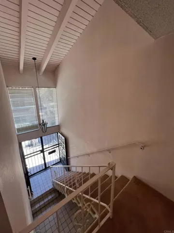 Vaulted ceilings make the entry feel spacious, grand, and welcoming.
