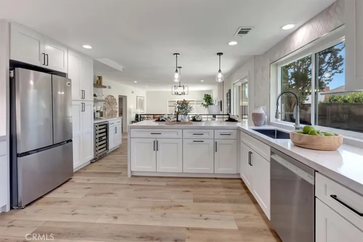 wine refrigerator, and premium stainless appliances including a Bosch range and dishwasher and counter depth refrigerator.
