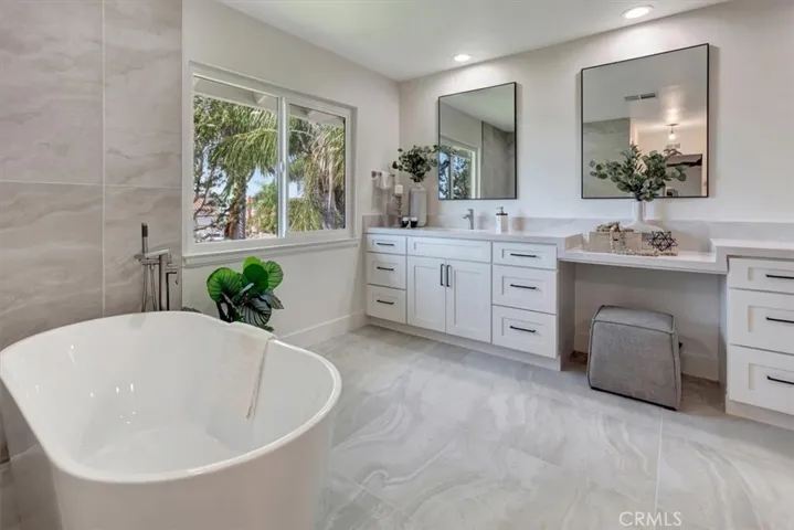 Bordeaux 59” acrylic free-standing tub & free-standing tub faucet.  Shaker style dual vanity cabinet w/plywood construction & soft close drawers & doors, Ivory Taj Quartz countertop & square porcelain sinks.
