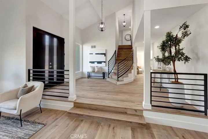 A dramatic two-story entry and 9’ double doors welcome you into an expansive foyer