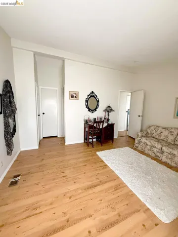 Living room with light wood finished floors and baseboards