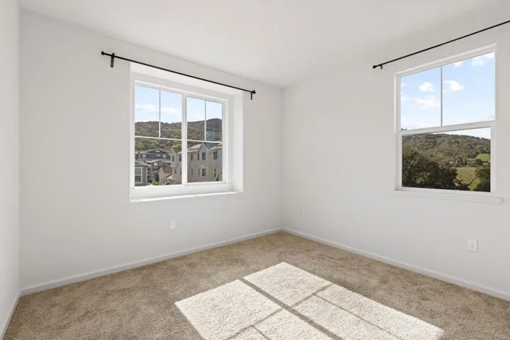 Comfortable additional bedroom with versatile use potential.