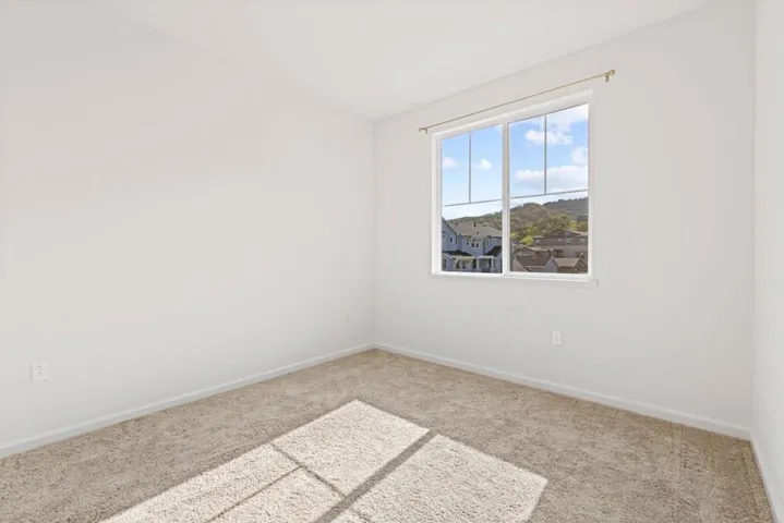 Spacious secondary bedroom ideal for a home office, guest room, or growing household.