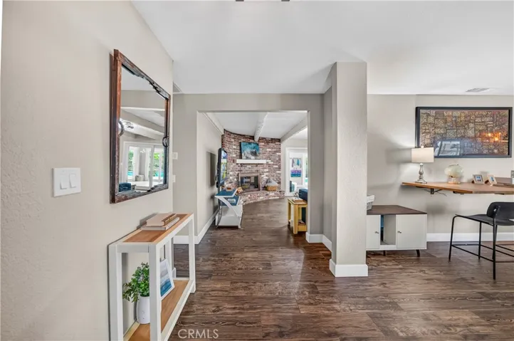 Entry way that leads to living and family rooms