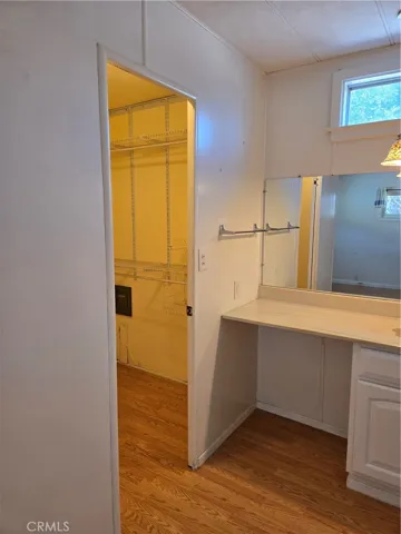 Walk-in closet in primary bathroom.