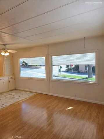Image has been digitally enhanced for lighting purposes. View from living room to dining room out front windows.