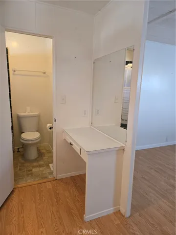 View from primary bedroom walk-in closet into primary bath.