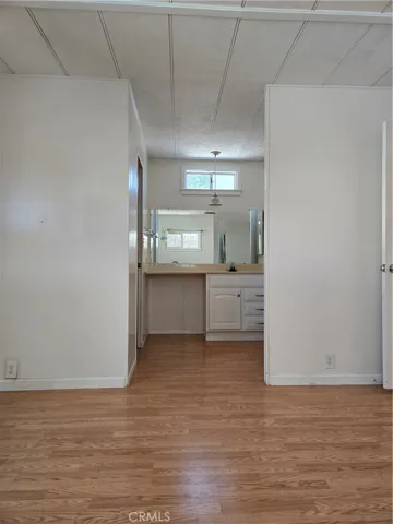 Primary bathroom, view from bedroom.