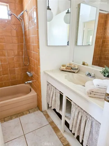 Image has been digitally staged. Hall bathroom.