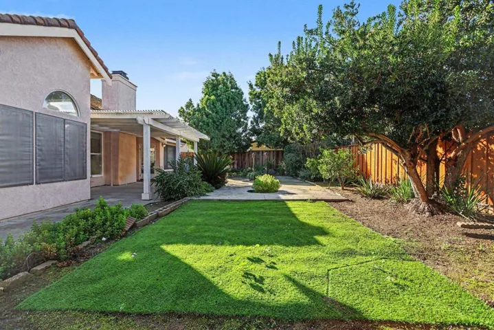 Fenced backyard featuring a patio area