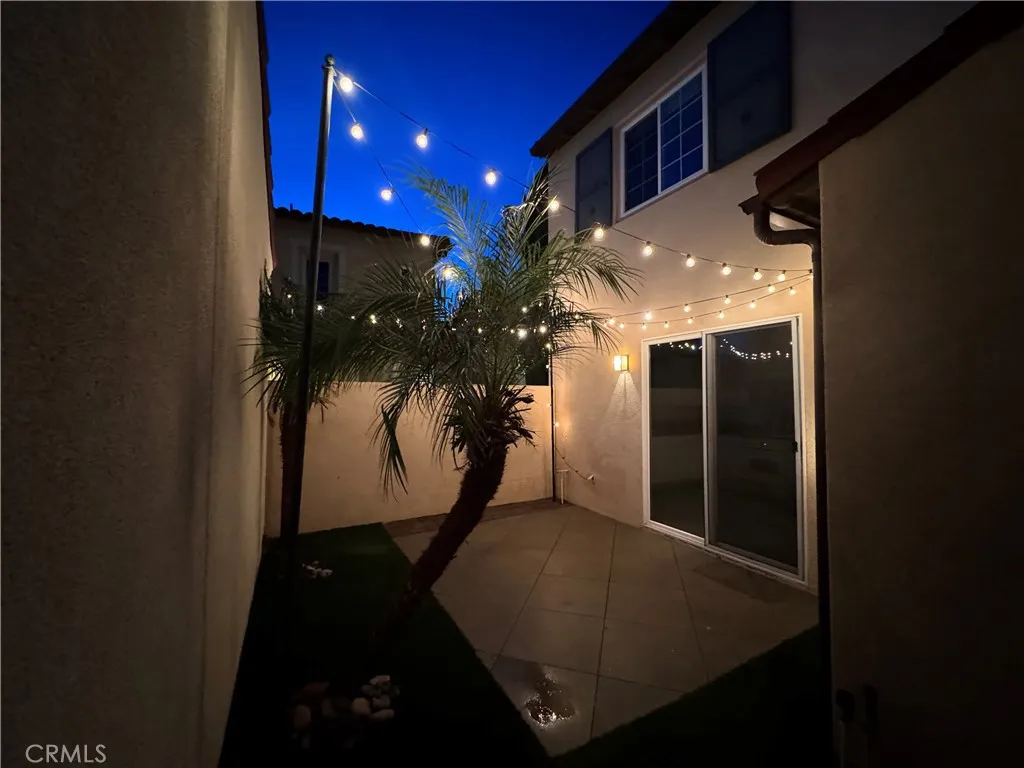 Rear yard twilight (from side gate access)