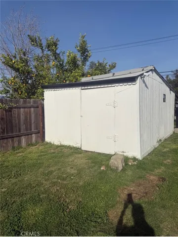 Storage or workshop building next to car park