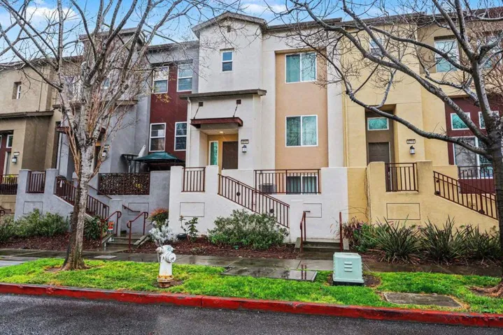 View of apartment building / complex featuring stairs