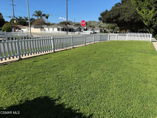 Large Front Yard with White Picket Fence